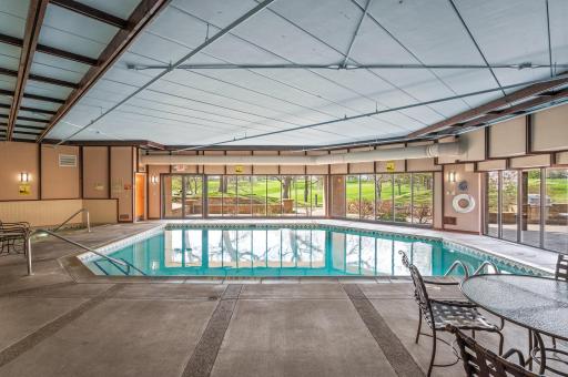 Shared amenities include large indoor heated pool and hot tub, exercise room, sauna, patio with grill, and underground heated garage.