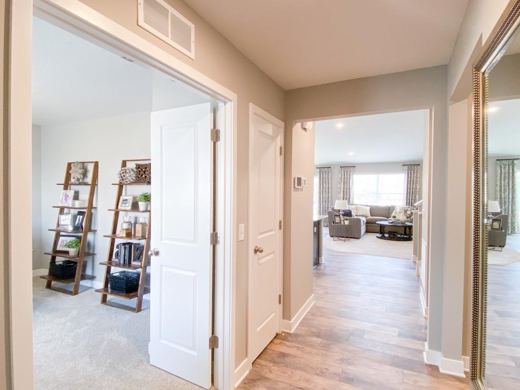 First impressions matter. Help leave a memorable one with this warm and welcoming introduction to your new home just steps inside the front door! Photo of model, colors will vary