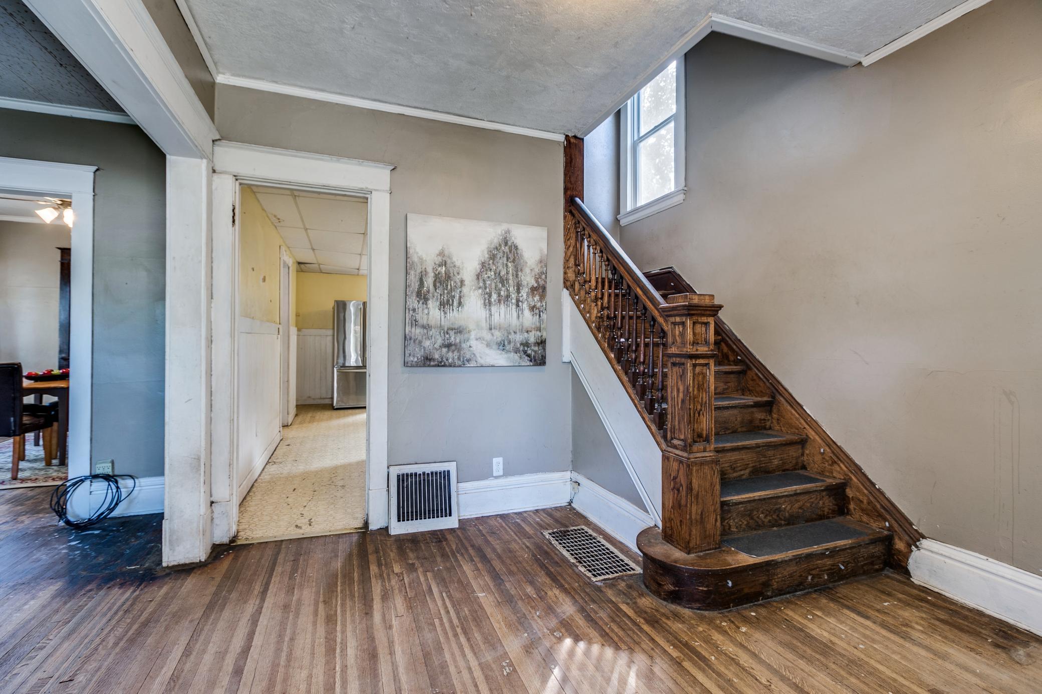 Photo for 372 Magnolia Avenue E, Saint Paul, MN 55130 - Listing #6423817 Spacious entry way with original wood staircase.