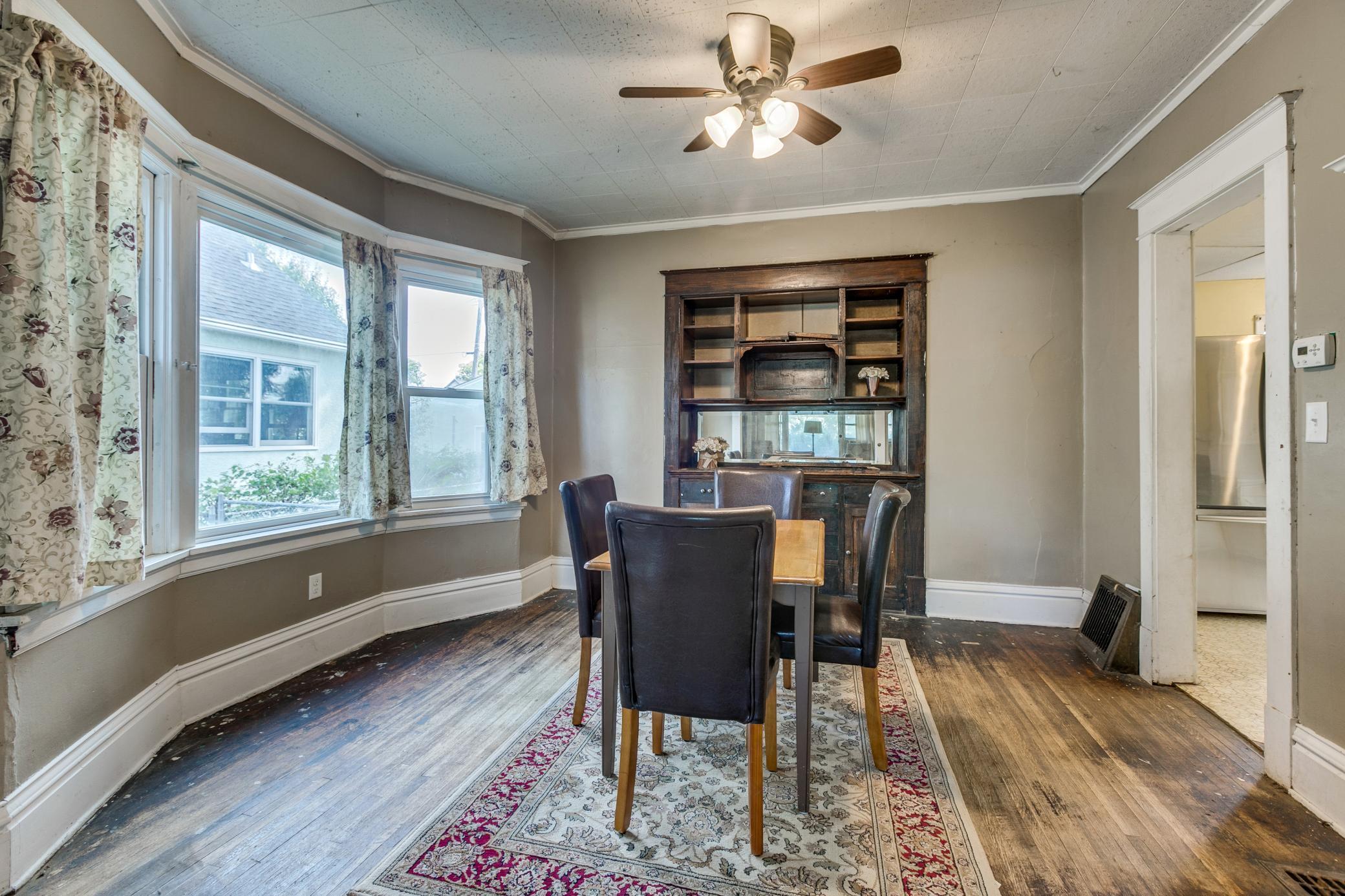 Photo for 372 Magnolia Avenue E, Saint Paul, MN 55130 - Listing #6423817 Spacious dining room with built-in hutch and large windows letting the sun shine in.