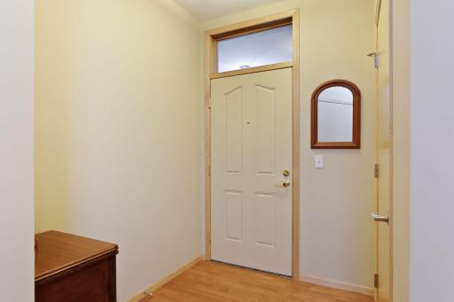 The front entry welcomes you in with EZ care laminate flooring and a guest coat closet.