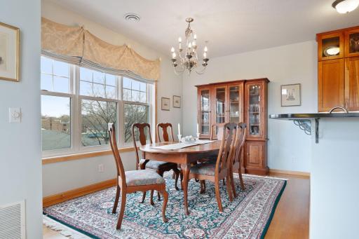 Enjoy treetop views from the expansive windows in the dining room, and note the eye-catching overhead lighting!