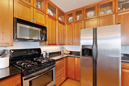 Stainless steel appliances include a stove, microwave, refrigerator and dishwasher. A pantry for your kitchen staples can be found nearby.