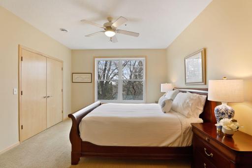 The spacious owner's suite will be your private retreat, with a cooling ceiling fan, soft-on-your-feet textured carpet, and wonderful windows for natural light.