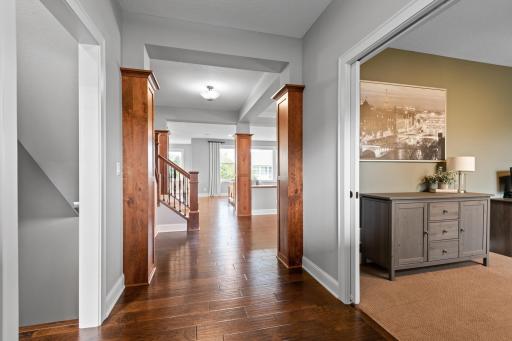 Warm hardwood floors extend through the foyer, dining, living room and kitchen.