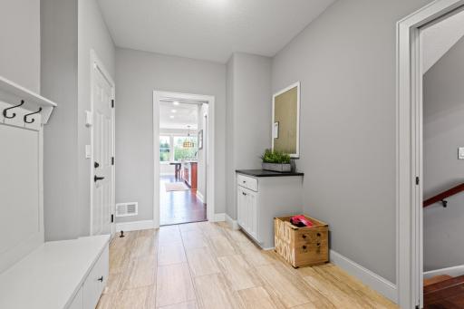 The large mudroom off the garage has plenty of storage for coats, backpacks and shoes, as well as a drop station for keys, mail or the family calendar.