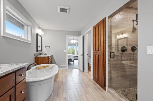Relax and unwind at the end of the day in this spacious master bath.