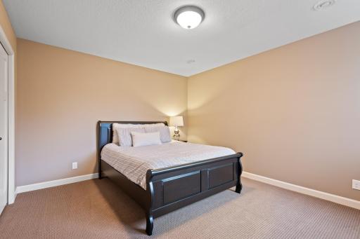 The lower level fifth bedroom can be utilized as a guest bedroom, workout room or craft room.