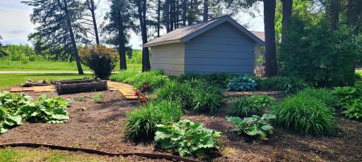 Back of storage shed included on the lot.
