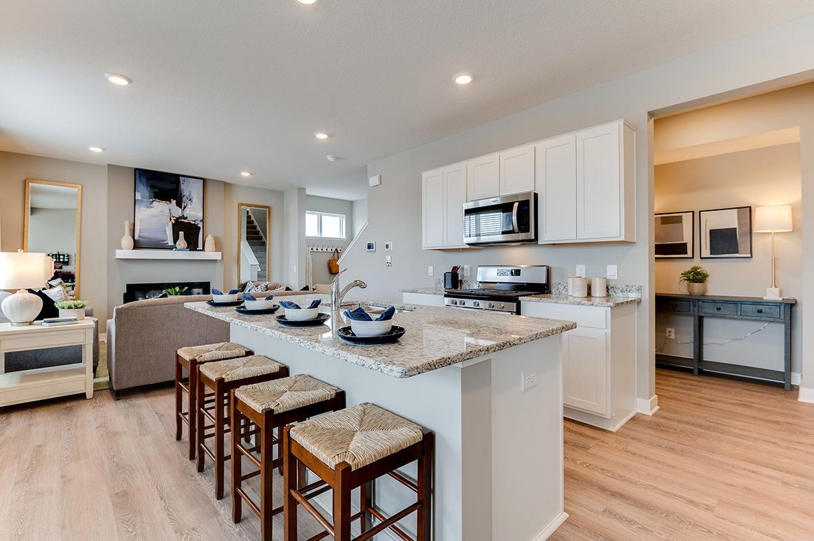 A kitchen built to perform - complete with stainless Whirlpool appliances and a vented micro hood, stunning cabinetry and loads of space to maneuver about!! Photo of model home, colors and features will vary.
