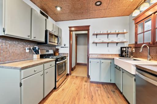 Stainless steel appliances, unique concrete countertops, great contrast of colors to fill this space