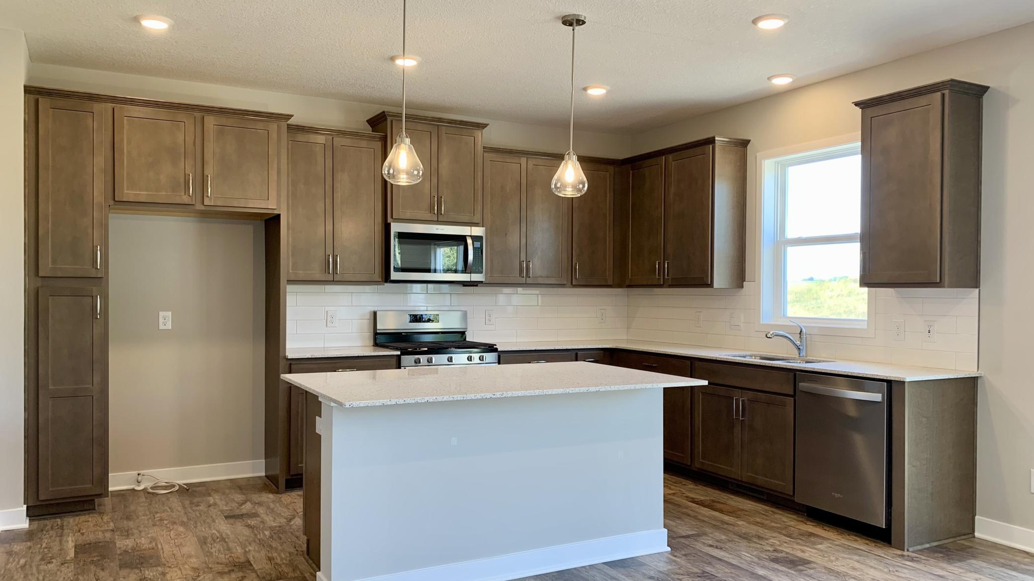 Welcome to the Bridgewater! Just completed 5 bedroom, new construction home located in desired Chaska. Nestled amongst mature trees, ponds and conservation while still conveniently close to all of the conveniences of shopping, dining, schools & more!