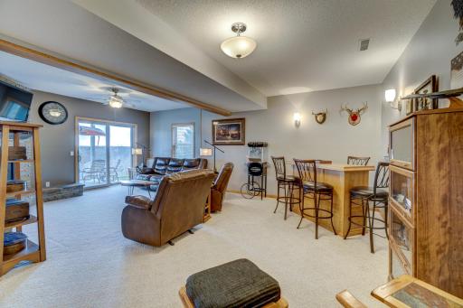 Downstairs, you’ll enjoy relaxation and functionality with a gas fireplace, walkout patio, and large mechanical room offering lots of storage space.