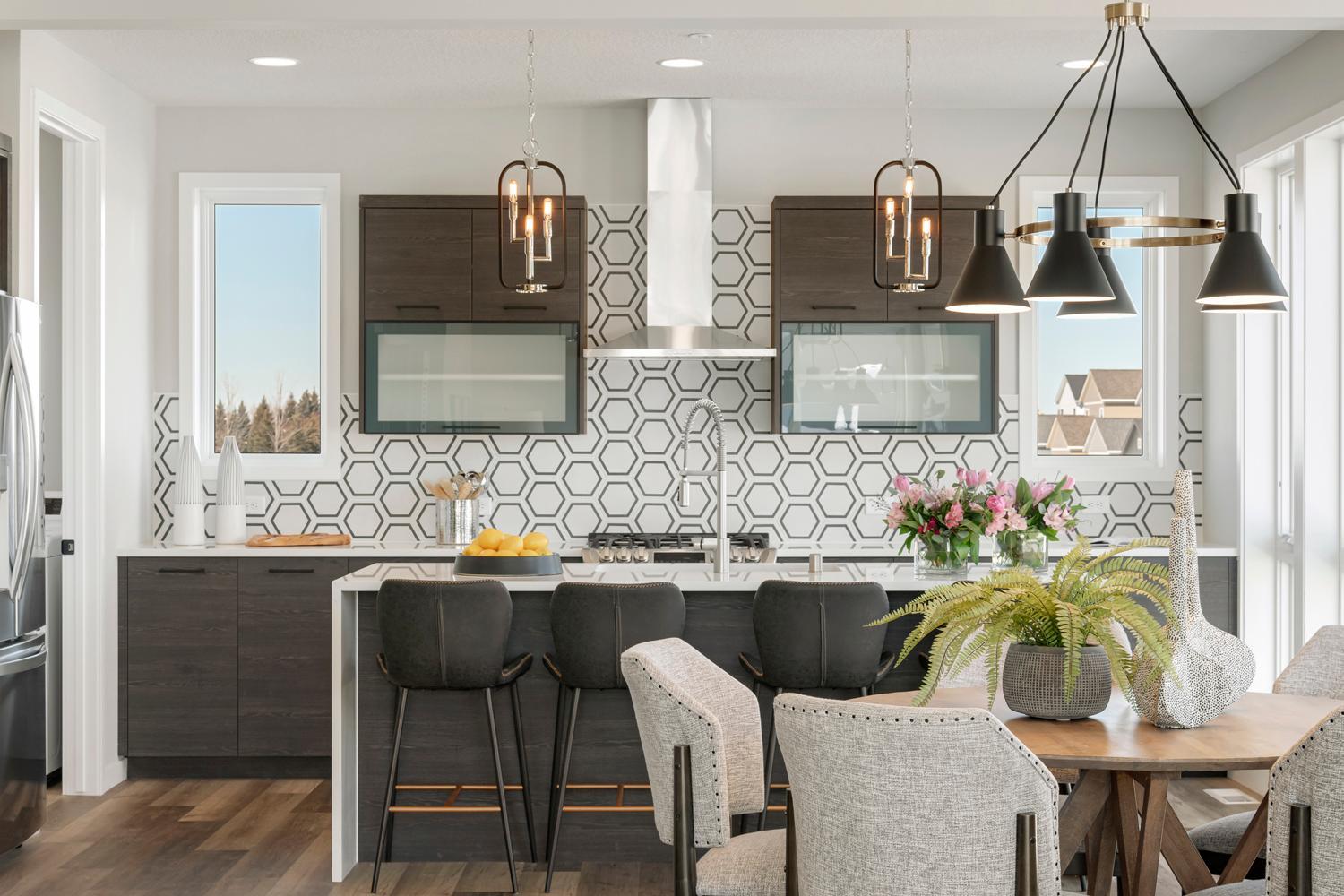 Urban inspired interiors with gourmet kitchens and luxury features. Photo is of model home; options and features will vary.