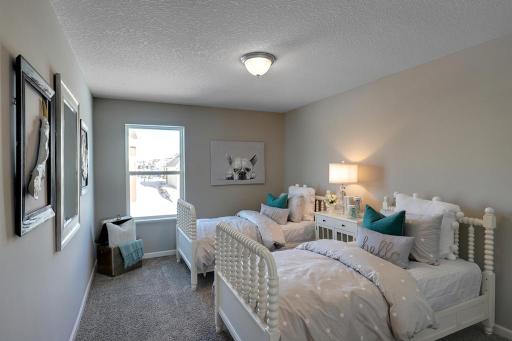 Each of the homes secondary bedrooms also offer an abundance of space! *Photo of previous model. Selections may vary, please see agent for details.