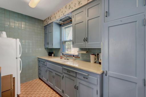 The kitchen has a lot of square footage and a lot of ceramic tile.
