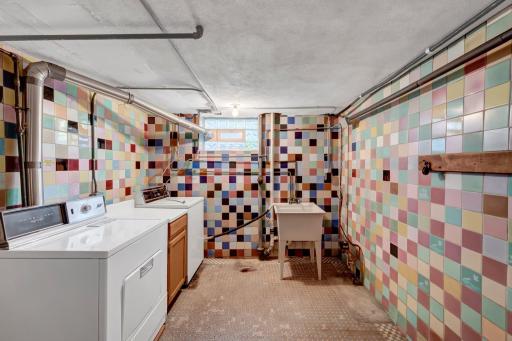 Laundry room, the tile floor is beautiful, the tiled walls are exciting!
