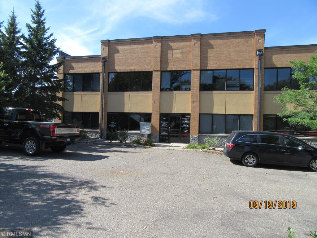 This parking lot is private off street parking for this building. Suite 100 is adjacent to this east entrance.