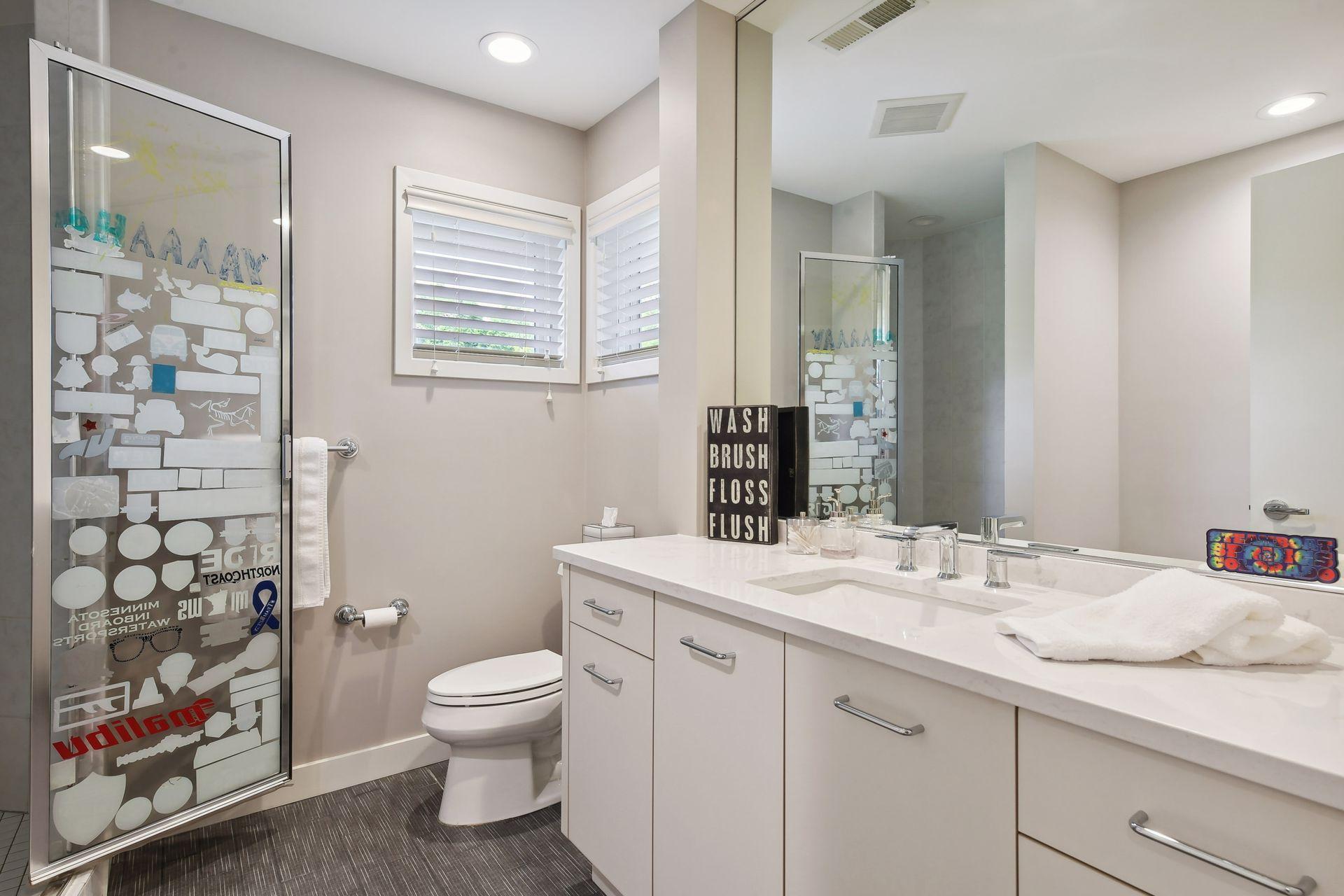 Upper level full bathroom with shower and bath.