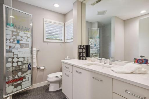 Upper level full bathroom with shower and bath.