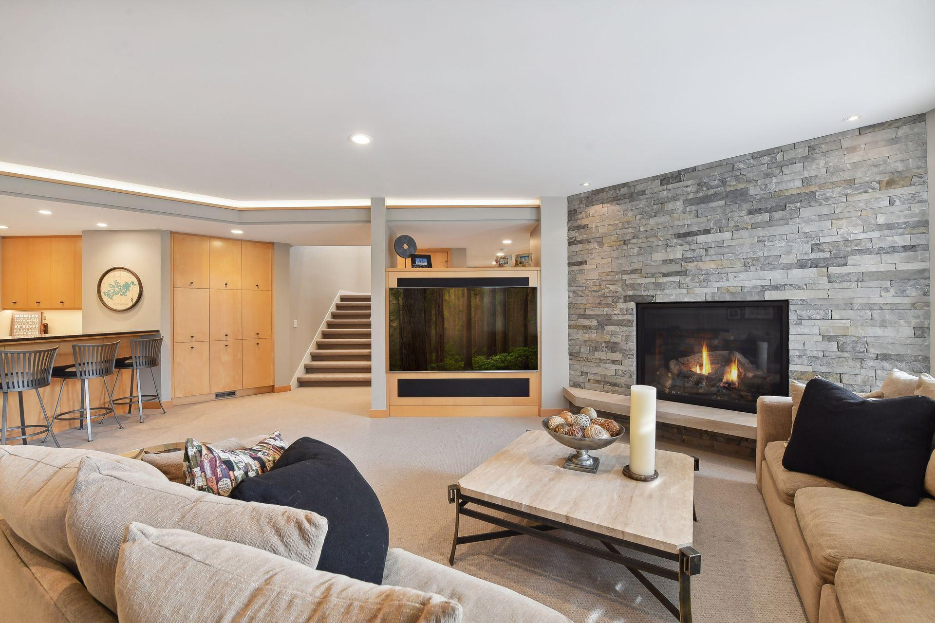 Lower level is well equipped with a large family/amusement area for media.