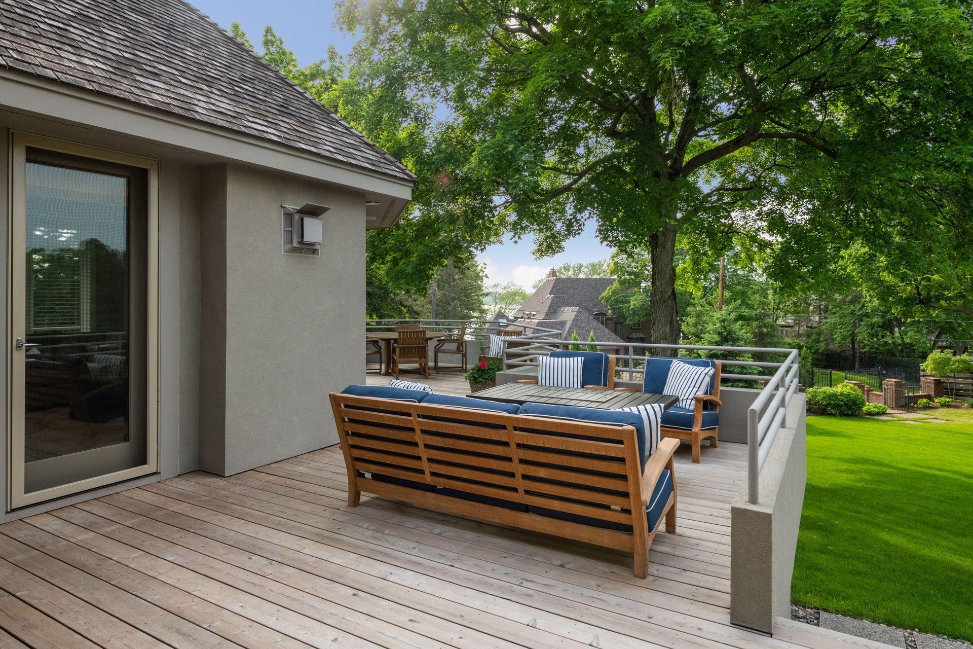 Outdoor deck spaces overlooking the lush back yard