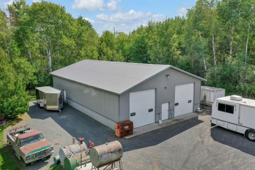 Ample firm surface parking areas around pole building and garage. Above ground fuel storage tanks will be removed. Truck body storage shed on the other side of the pole building.
