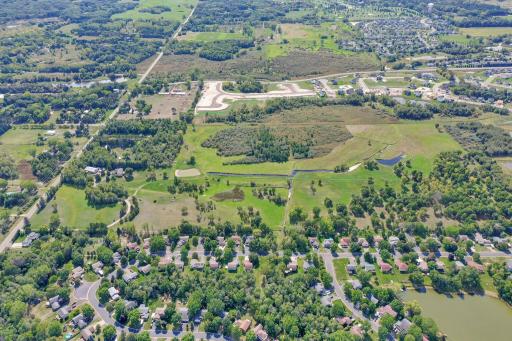 Property runs left to right and is in this Southern facing photo. Goodview on the left side. Housing development along the North boarder. Water canal in the center of the 70 acres.