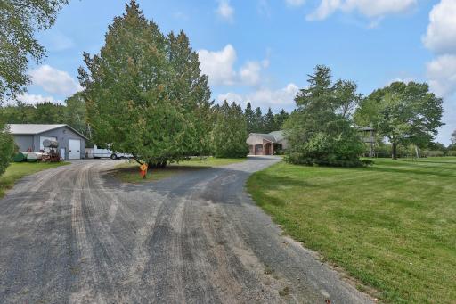 Approach to the circle drive to pole building and home.