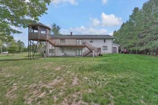 Rear of home with deck. Home in southeast portion of the property.