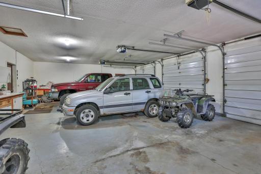 Over sized attached 3 car garage with individual roll up doors.