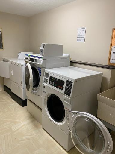 Laundry room down the hall from unit