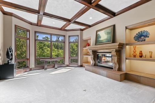 Living Room With Fireplace And Window View.jpg