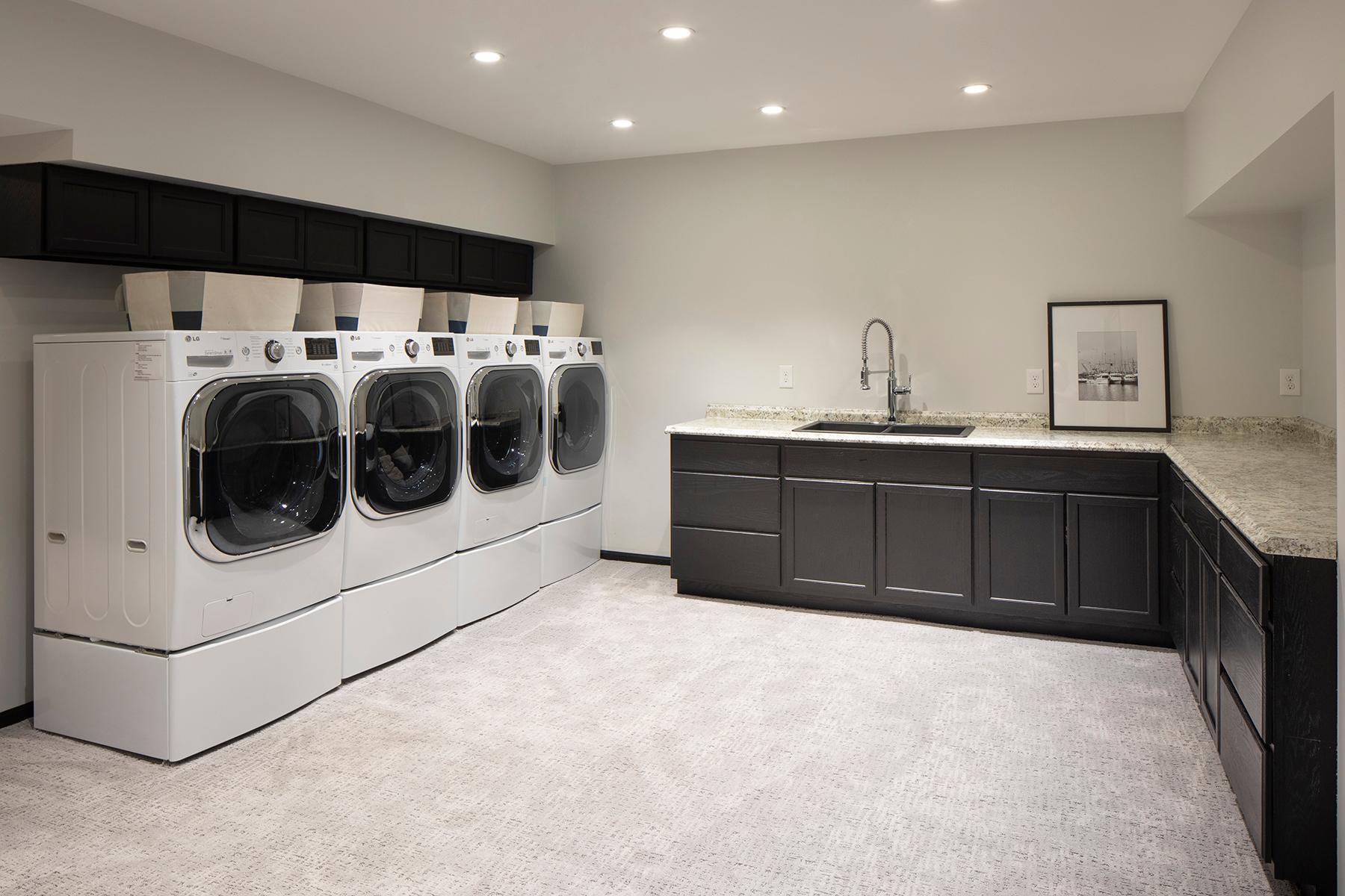 Lower Level Laundry Room with two washers and two dryers.