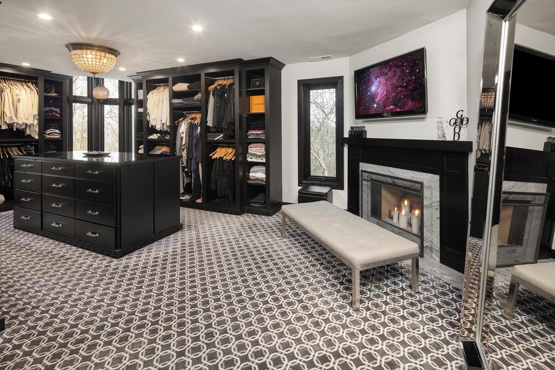 Impressive closet and dressing area for the primary bedroom.