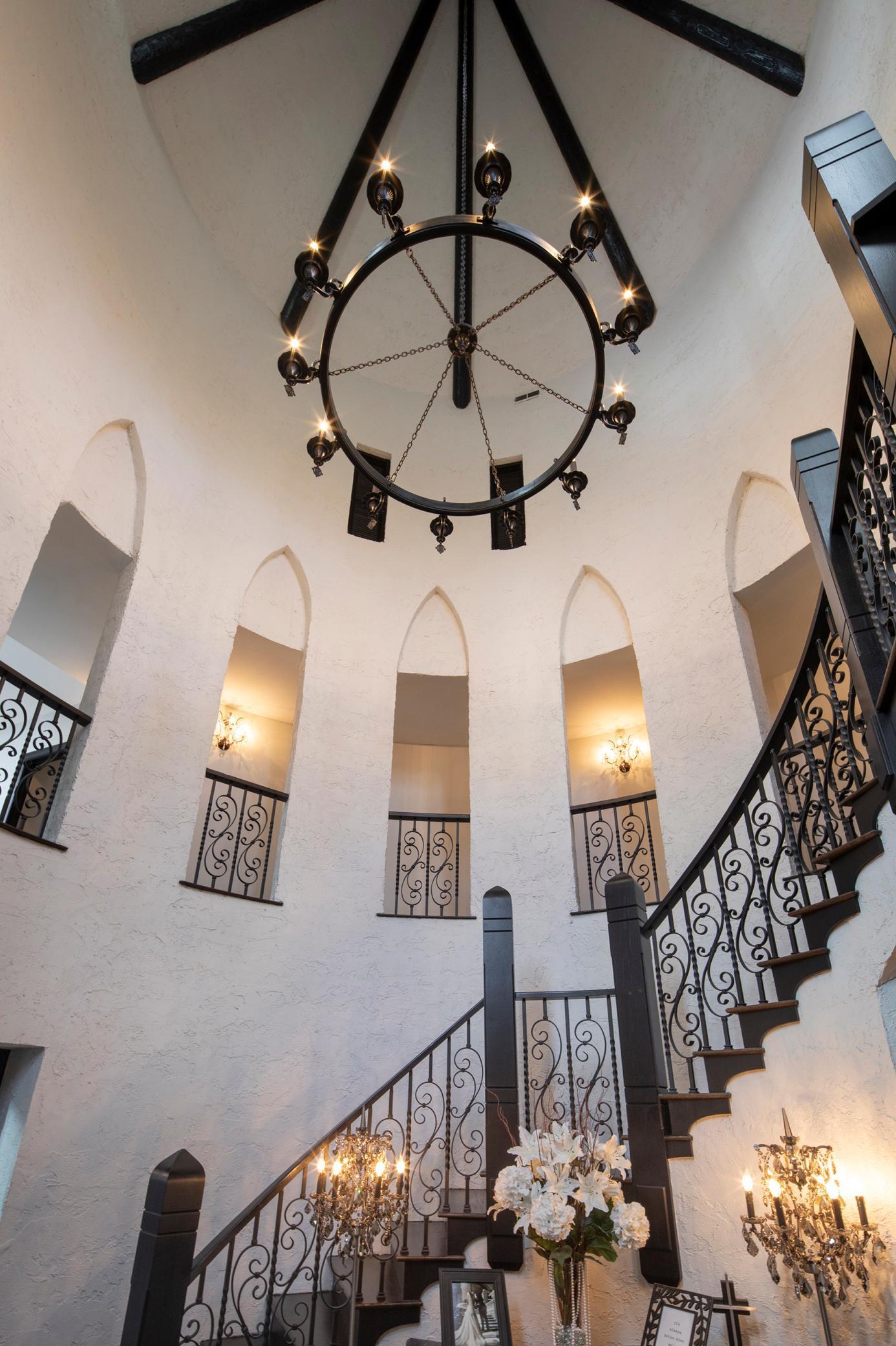 Enter this gracious home thru the grand turreted foyer with beautiful marble floors..