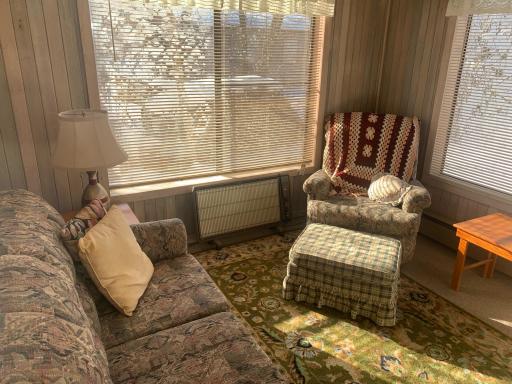 Detached sun porch with electric heat.