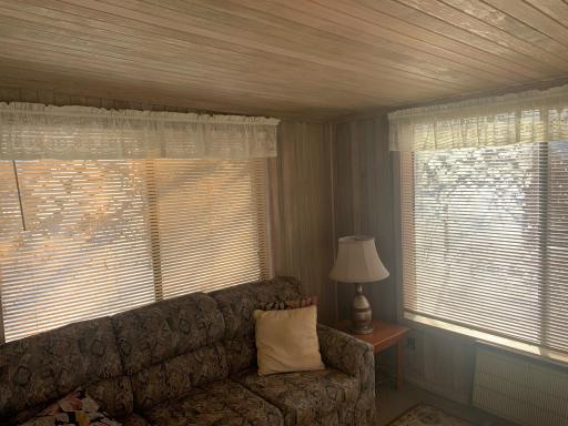 Detached sun porch with electric heat.