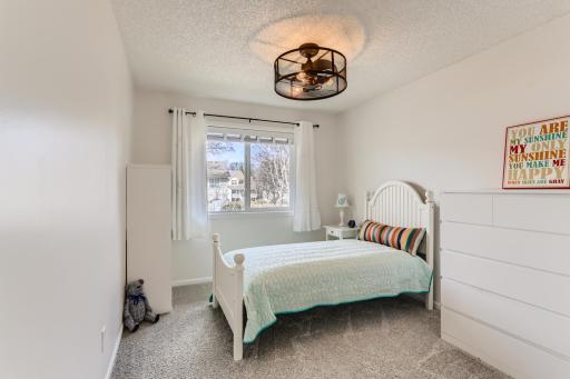 Photo for 410 Lancaster Lane N, Champlin, MN 55316 - Listing #6184032 The third bedroom on the upper level also has fresh paint and new carpet. Check out that updated fan/light combo!