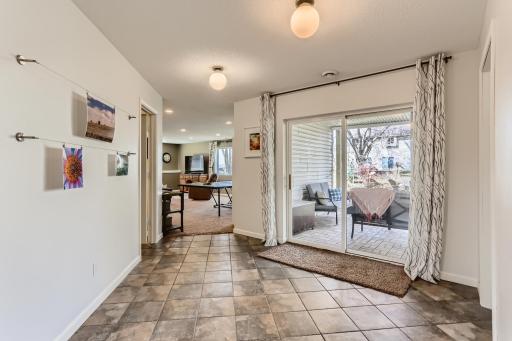 Photo for 410 Lancaster Lane N, Champlin, MN 55316 - Listing #6184032 As you head downstairs, the tiled flooring makes clean up a breeze when coming in from the walkout sliding door!