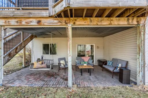 Photo for 410 Lancaster Lane N, Champlin, MN 55316 - Listing #6184032 Underneath your deck is a large patio, another great hang out spot! Enjoy the sunsets on your swing!