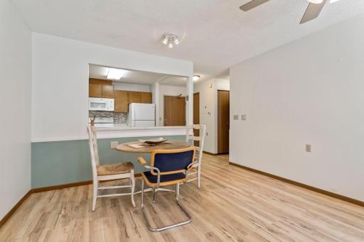 Dining area next to opening to kitchen.
