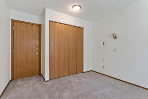 Bedroom with new plush carpeting.