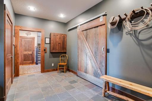 Custom Made Barn Door Can Be Found In The Mudroom