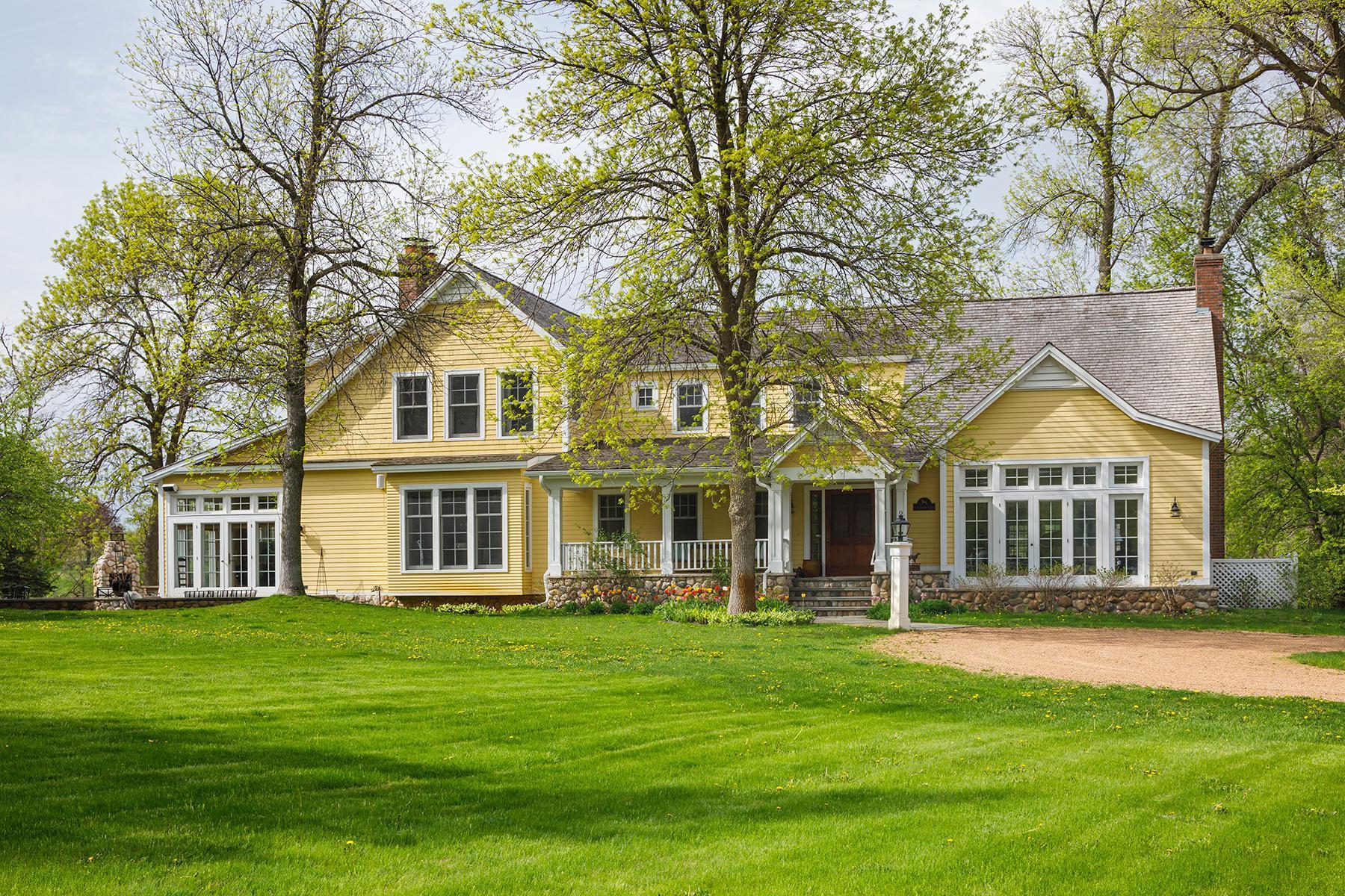 This charming home is shaped by peaked gables, dormers, and porches, that echo the architectural character of the original farmhouse.