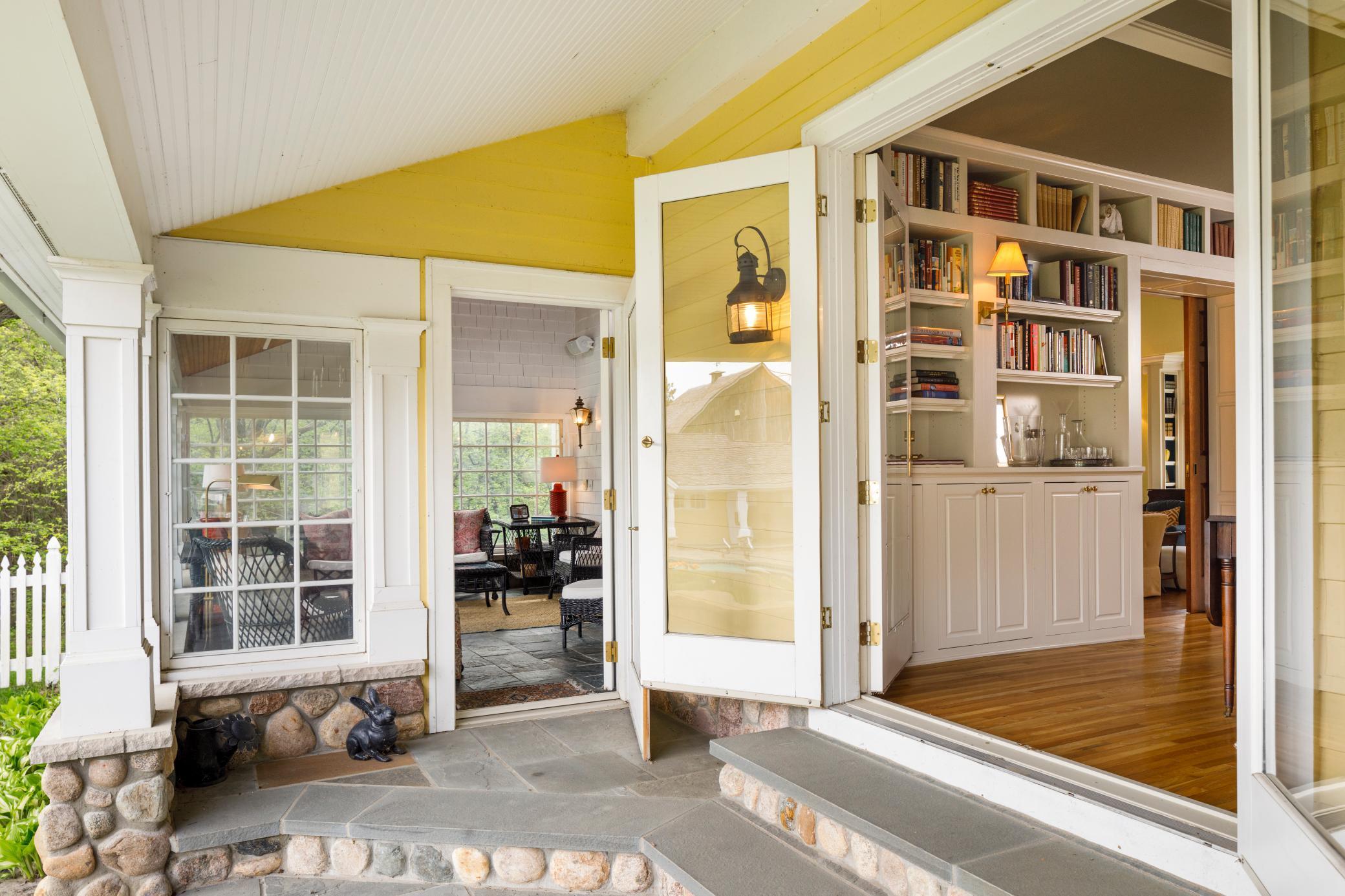 Access to sunroom and library off the English garden courtyard.