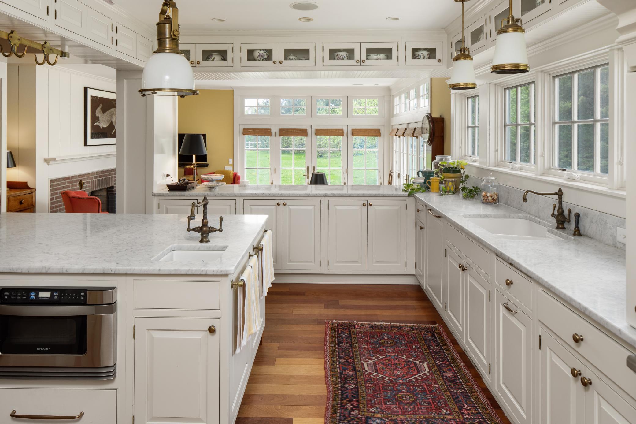 The perfectly appointment kitchen opens to the main level family room.