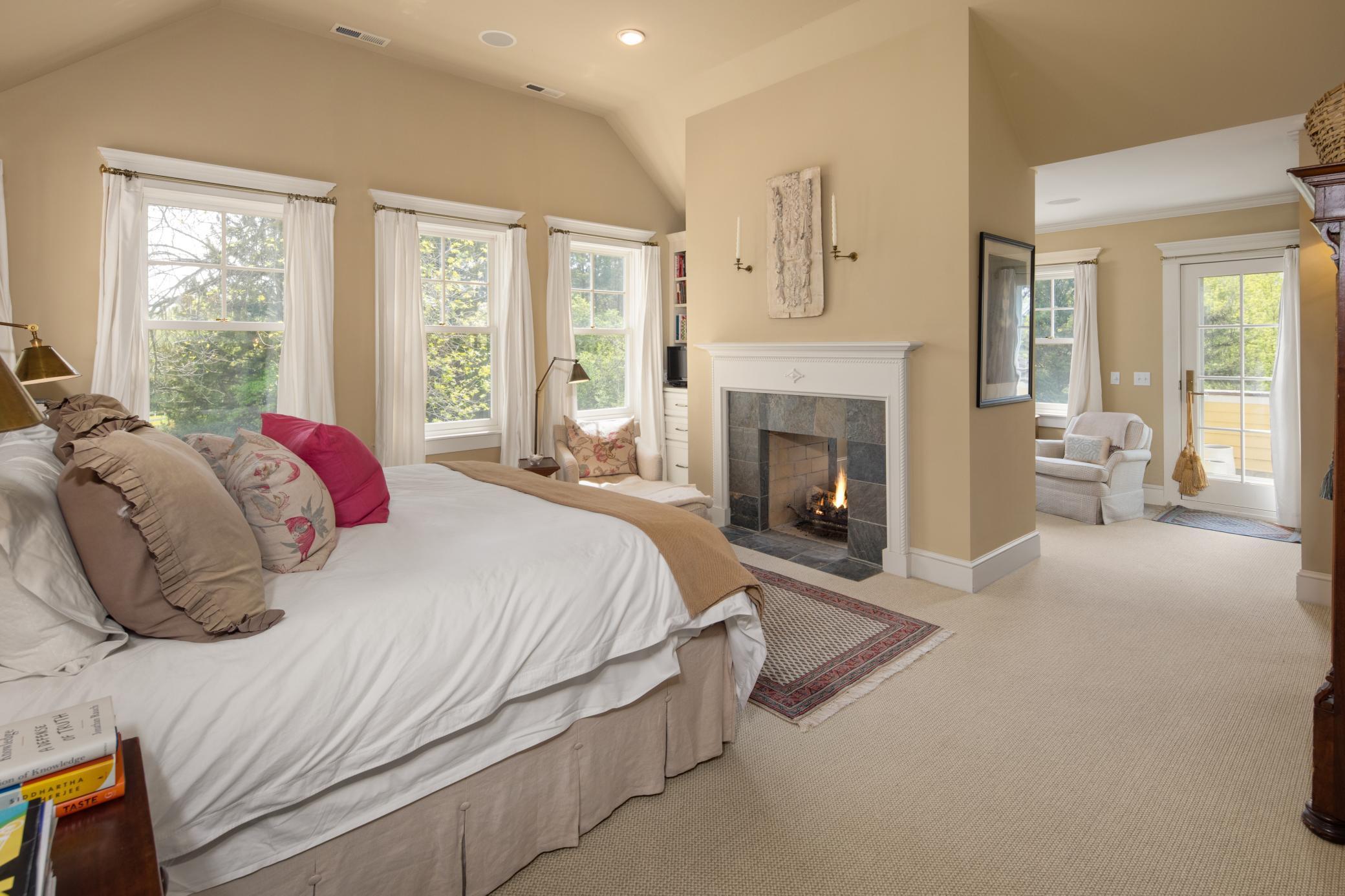 Graciously sized owner's suite with see through gas fireplace, walk in closet, sitting area, private balcony and full bathroom.