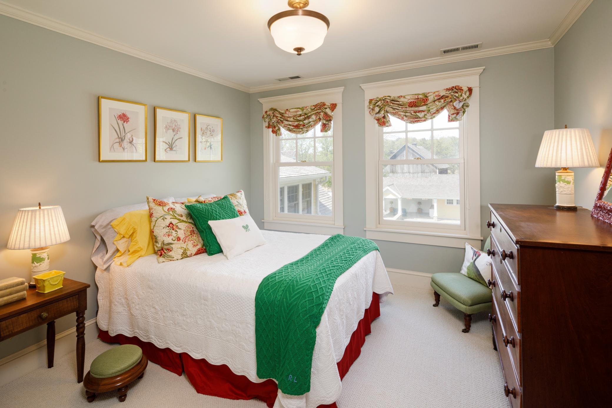One of two additional bedrooms on the upper level with courtyard views.