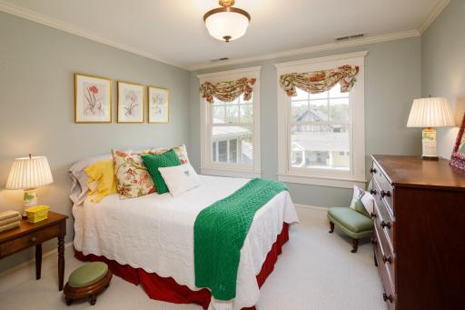 One of two additional bedrooms on the upper level with courtyard views.